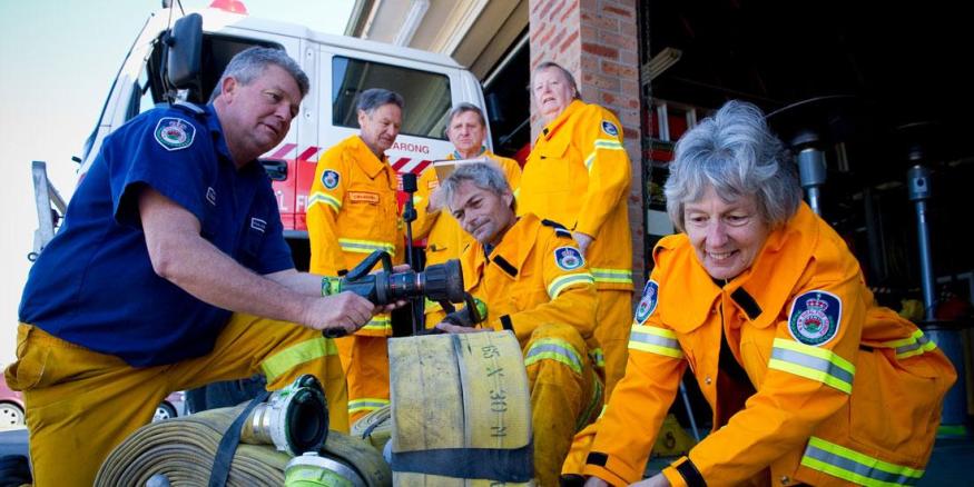 Image of a group a CFS using a fire hose<br />
;